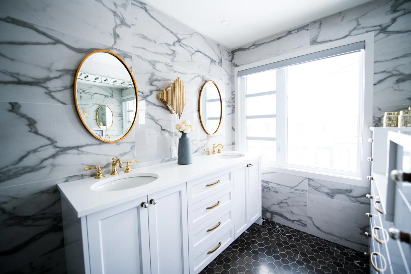 Renovated bathroom with double sink vanity and large mirror